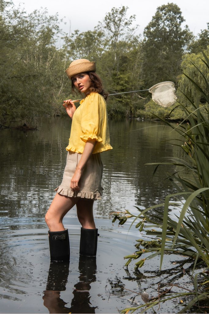 Editorial womenswear photograph in a riverside landscape by London fashion and lifestyle photographer Lucy Rappolt