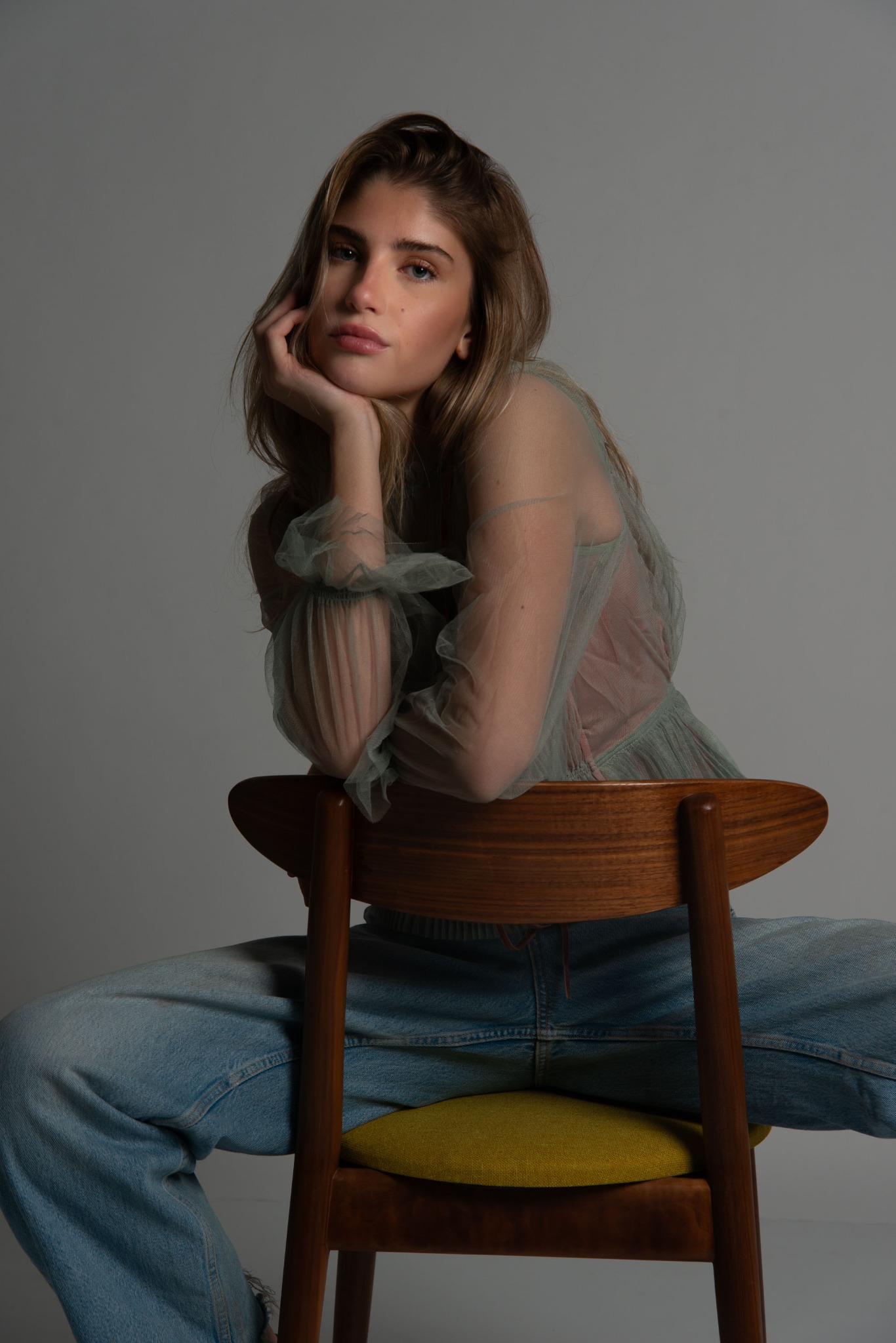 Dark editorial studio portrait