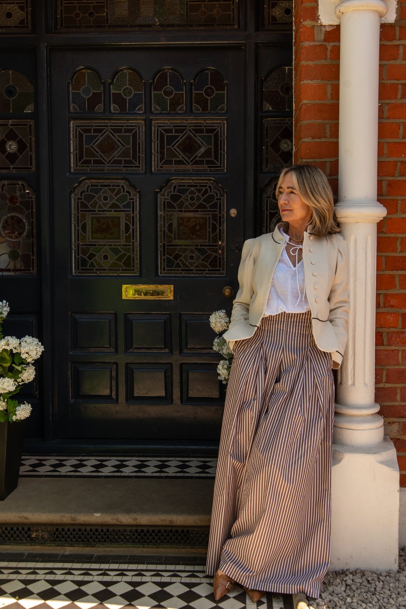 Environmental portrait outside a period London house